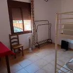 Quarto em Acomodações Particulares Habitación En Casa Vacacional